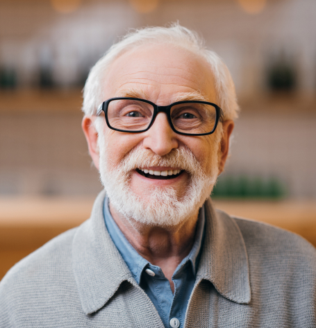 Smiling senior patient cared for by Warwick Dental team OKC